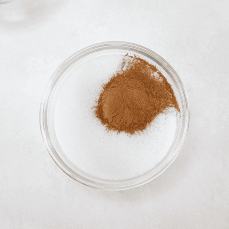 Small bowl containing granulated sugar and ground cinnamon mixed together
