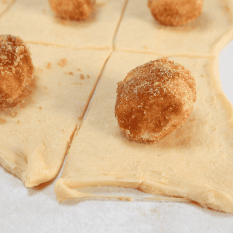 Coated marshmallow placed in center of crescent dough square