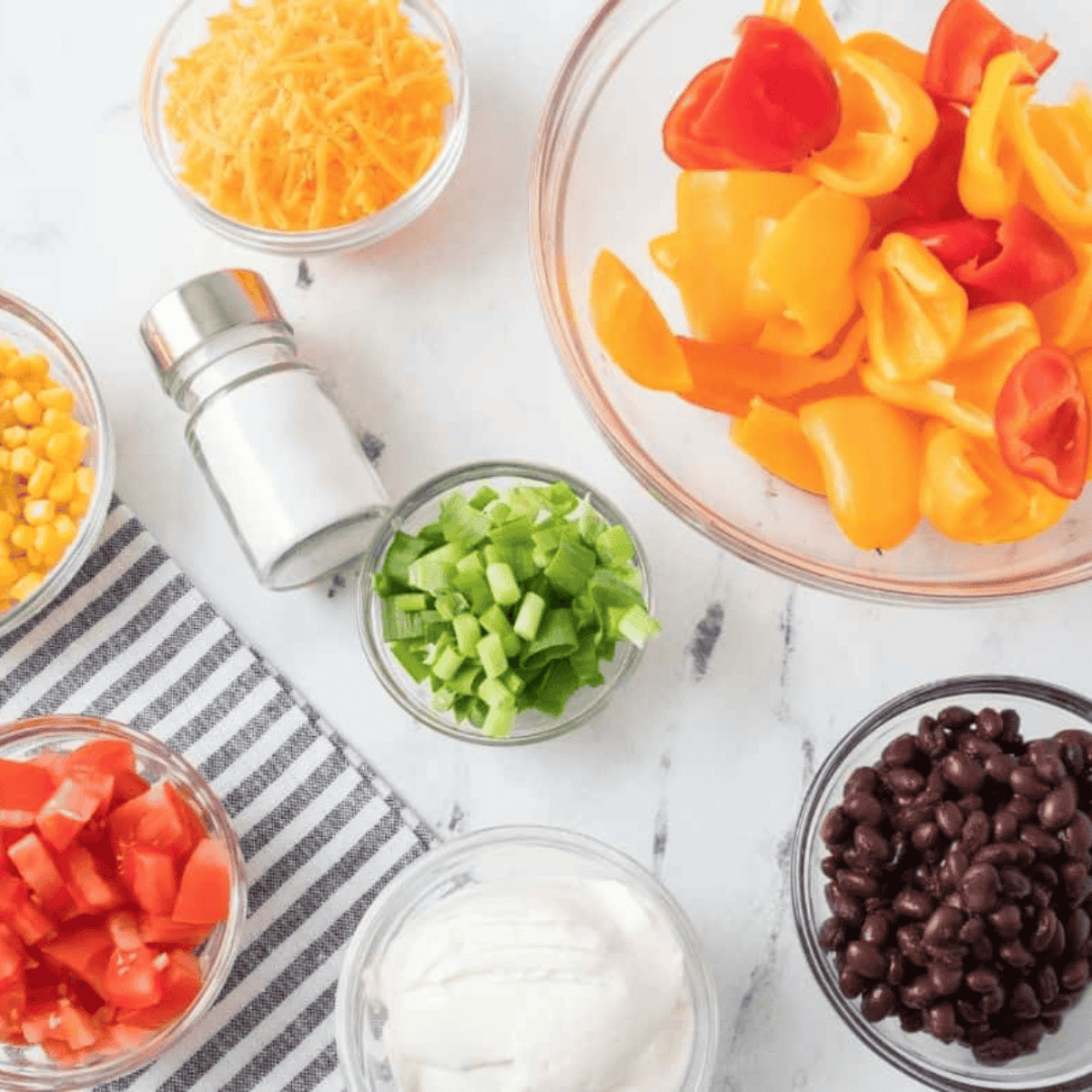 Ingredients needed for Easy Air Fryer Mini Pepper Nachos on kitchen table.