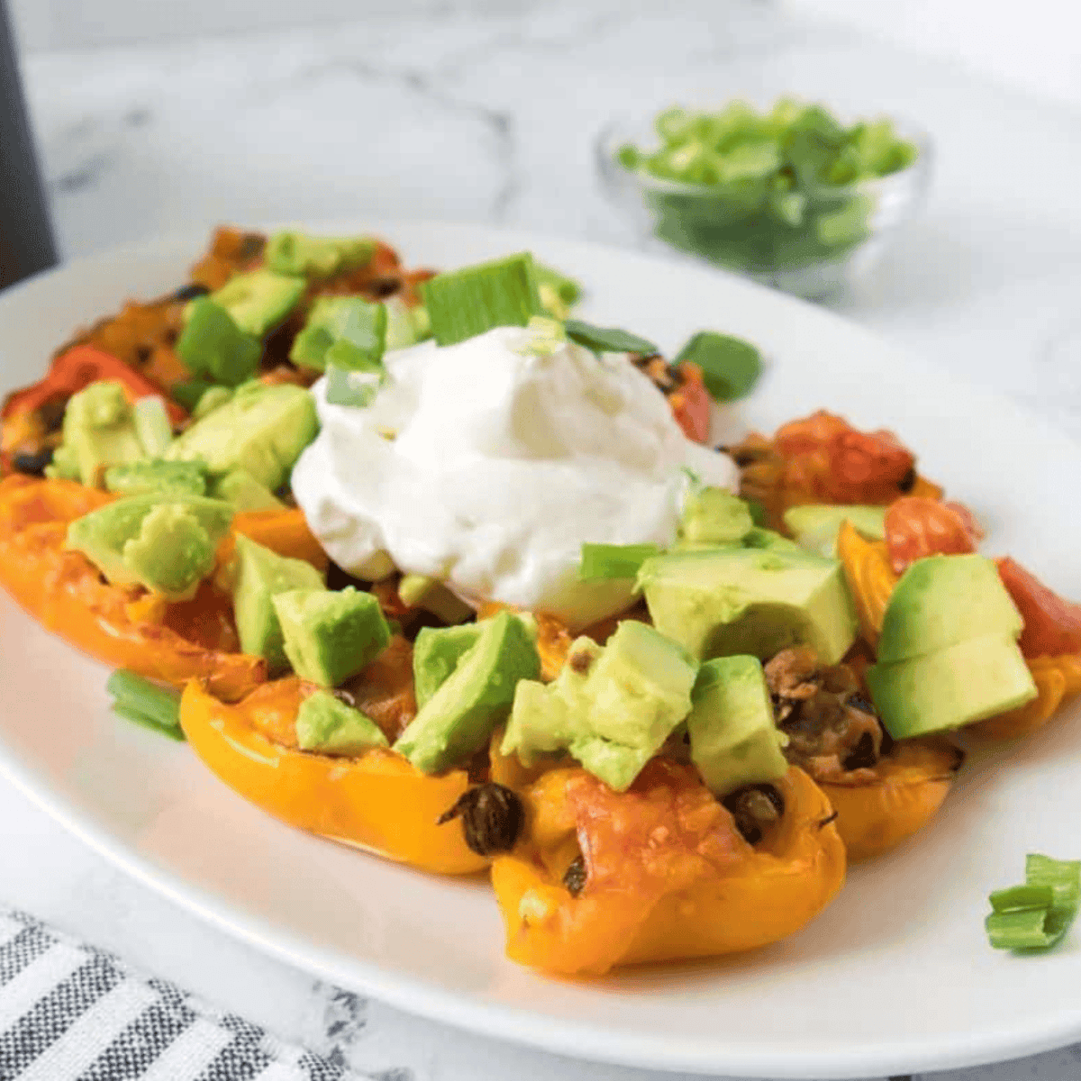 Plated mini pepper nachos ready to serve and enjoy.