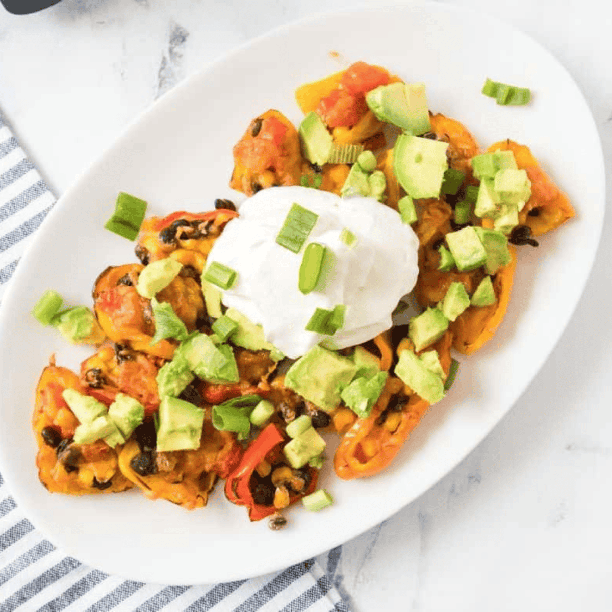 air fryer mini pepper nachos with melted cheese and toppings