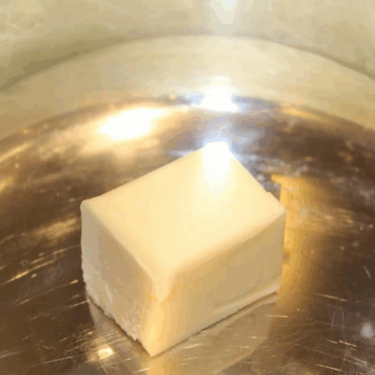 Butter melting in the Instant Pot bowl while being stirred on saut&eacute; mode