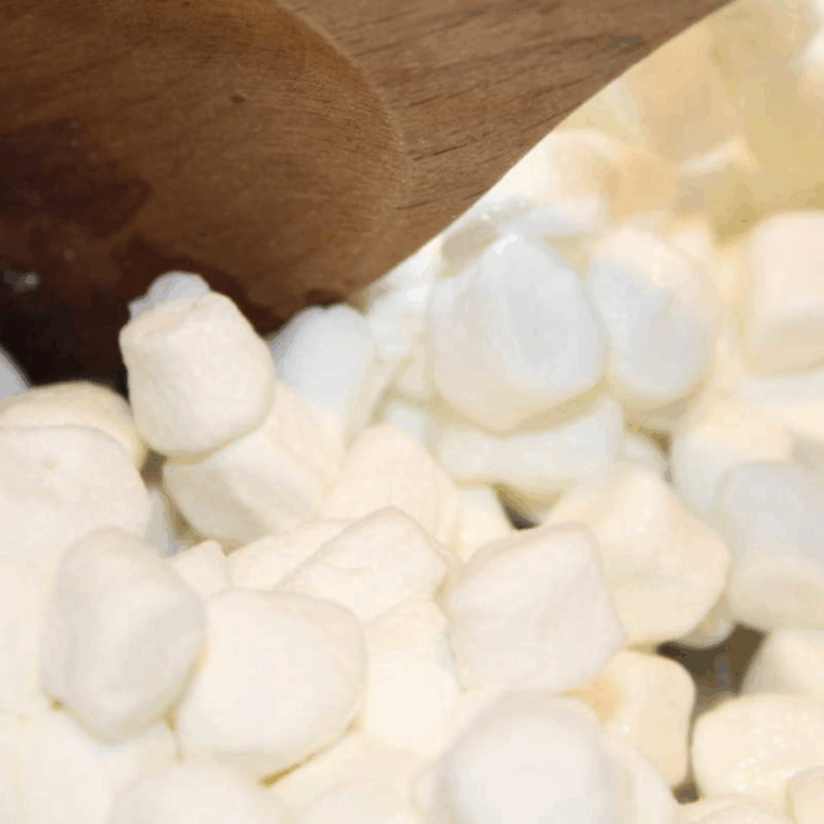 Marshmallows melting in the Instant Pot with butter, stirred to a smooth mixture