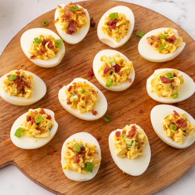 Southern deviled eggs made in the Instant Pot, topped with paprika and arranged on a serving plate.