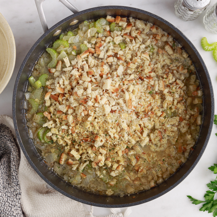 Shredded chicken, green peas and parsley stirred into creamy gravy, poured into a 9x13 baking dish