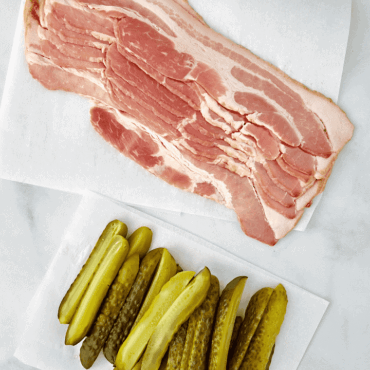 Patting dill pickles dry with a paper towel before air frying