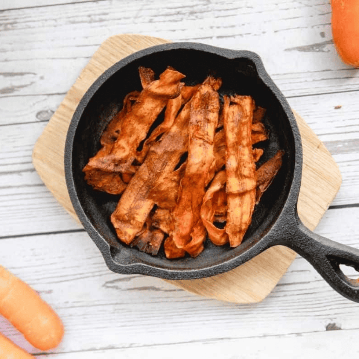 Golden, crispy carrot bacon strips cooked in an air fryer, ready to serve.