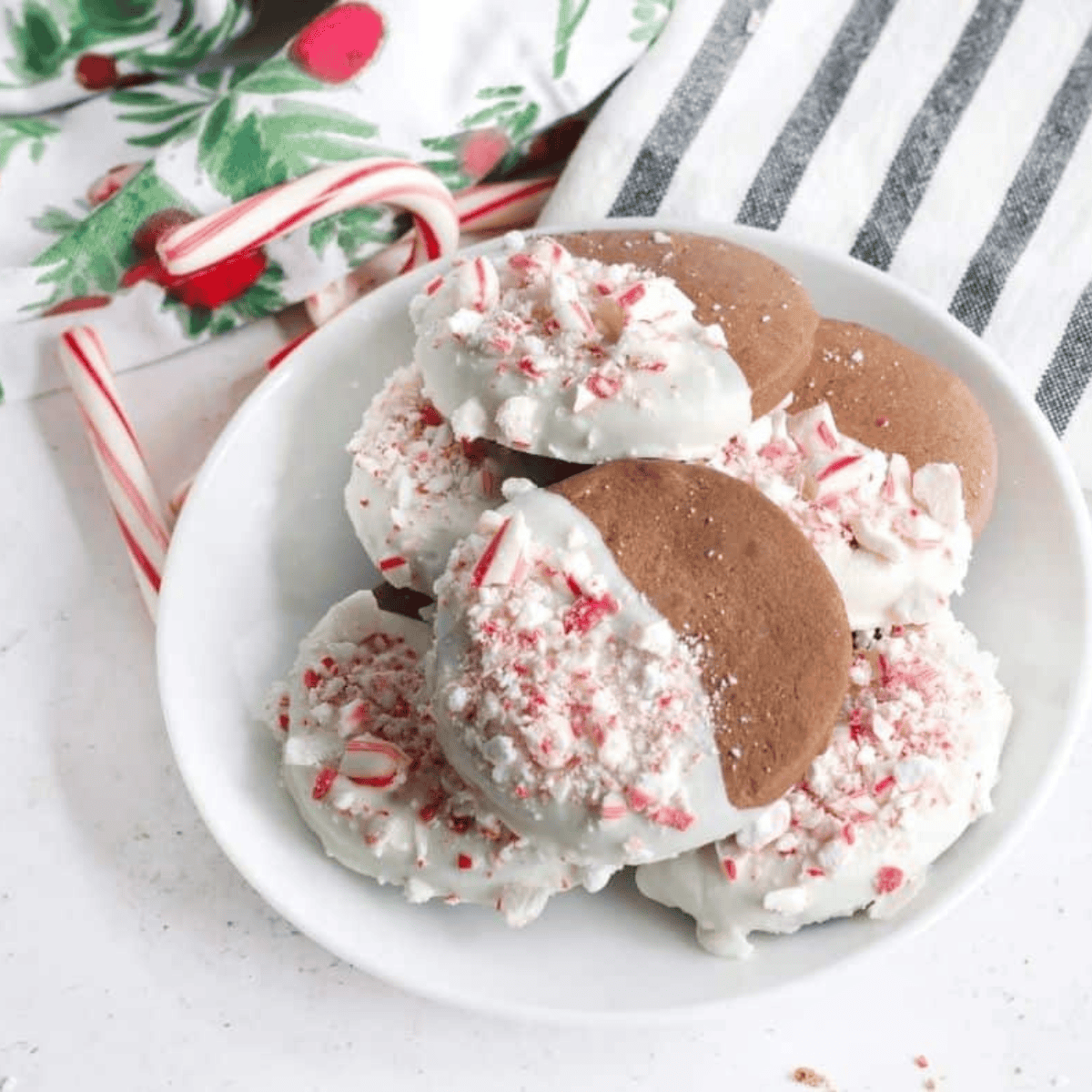 Air fryer dark chocolate peppermint cookies cooling on a rack topped with crushed candy canes