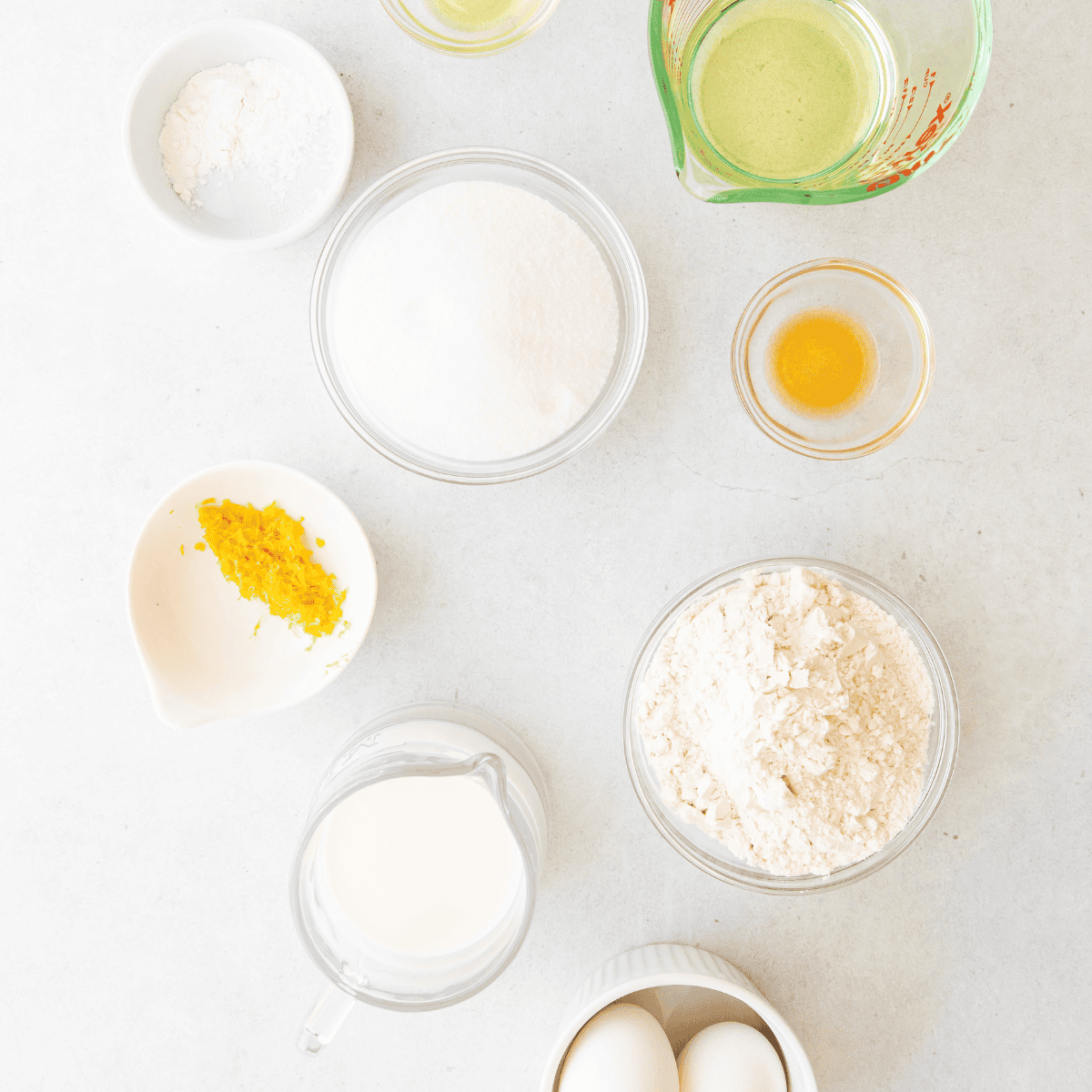 Ingredients needed for Air Fryer Lemon Cupcakes on kitchen table.