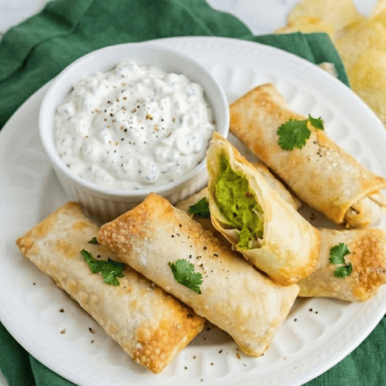 golden crispy air fryer avocado egg rolls with creamy avocado filling