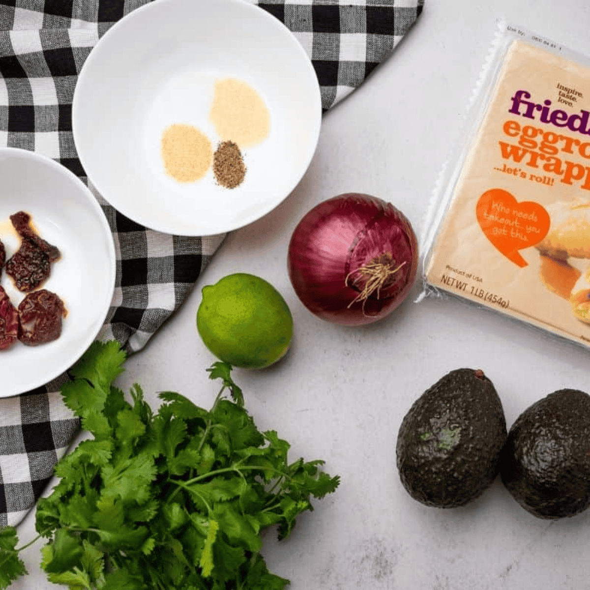 Ingredients needed for Copycat Cheesecake Factory Avocado Egg Rolls Air Fryer on kitchen table.