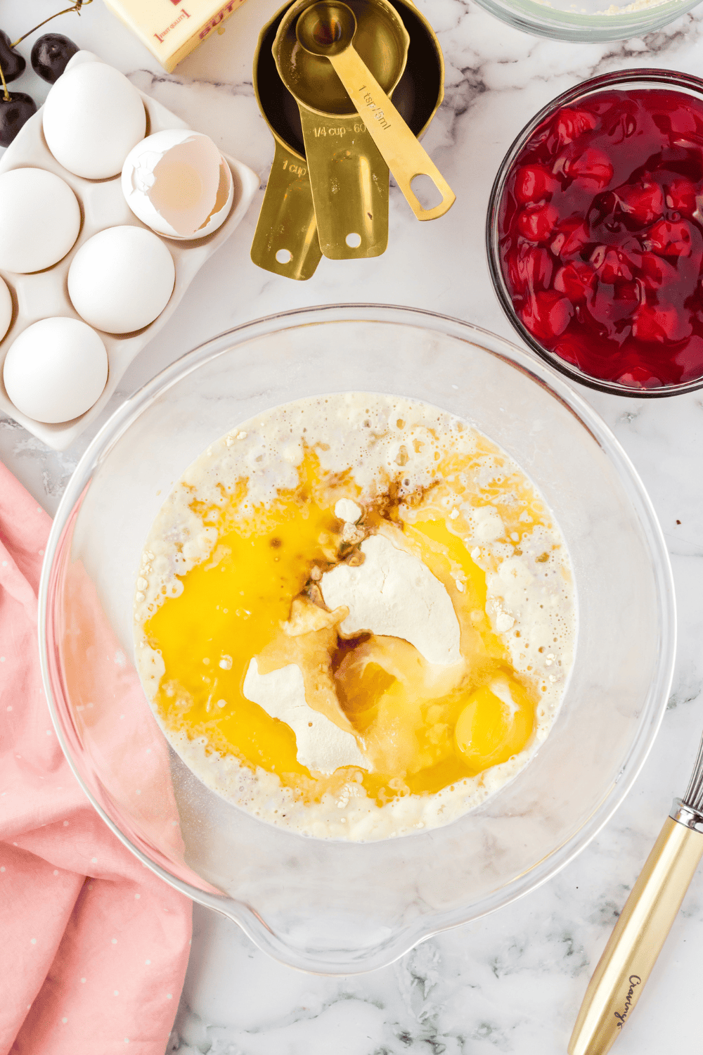 Blooming yeast in warm milk and sugar mixture for cherry pie air fryer donuts.