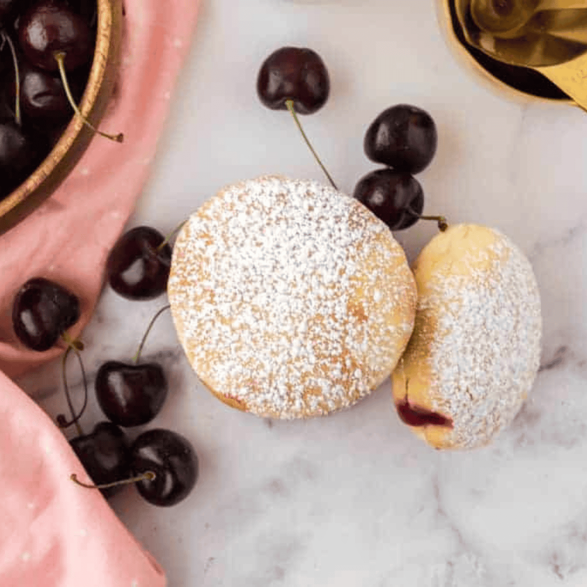 Freshly made air fryer cherry pie donuts arranged on a serving plate.