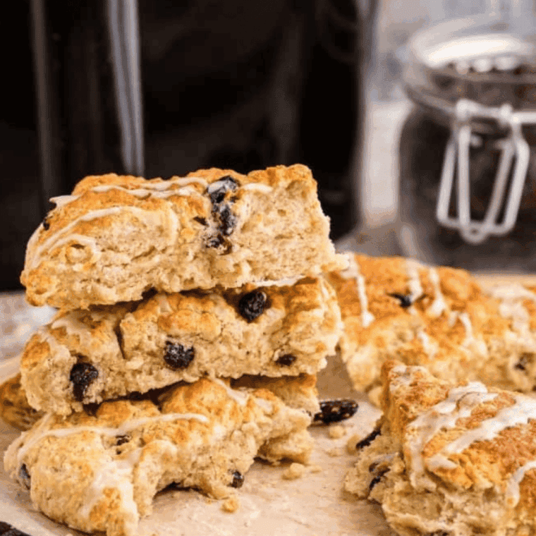 Air fryer cinnamon raisin scones golden-brown, flaky, and studded with plump raisins.