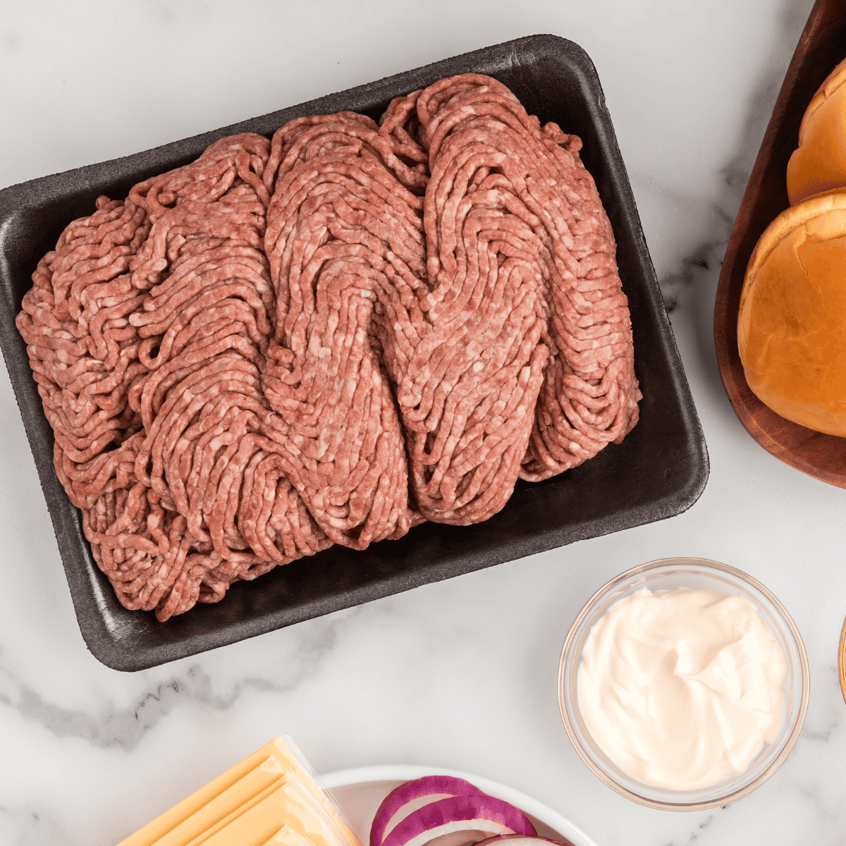 Ingredients needed for Air Fryer New York Style Chopped Cheese Recipe on kitchen table.