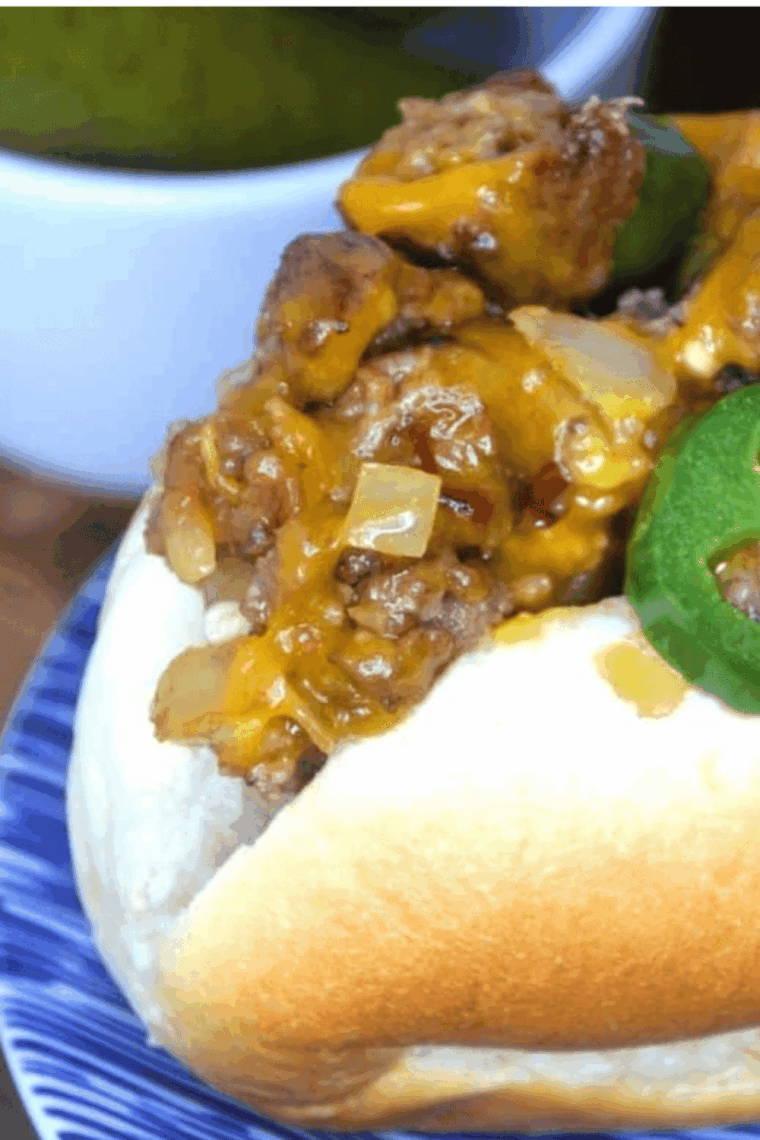 Air Fryer New York Style Chopped Cheese sandwich with chopped beef, melted cheese, sautéed onions, and jalapeños on a toasted roll