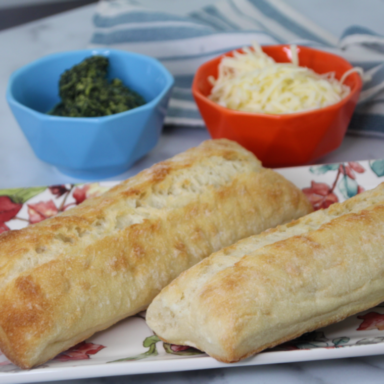 Ingredients needed for Air Fryer Spinach Florentine Pizza on kitchen table.