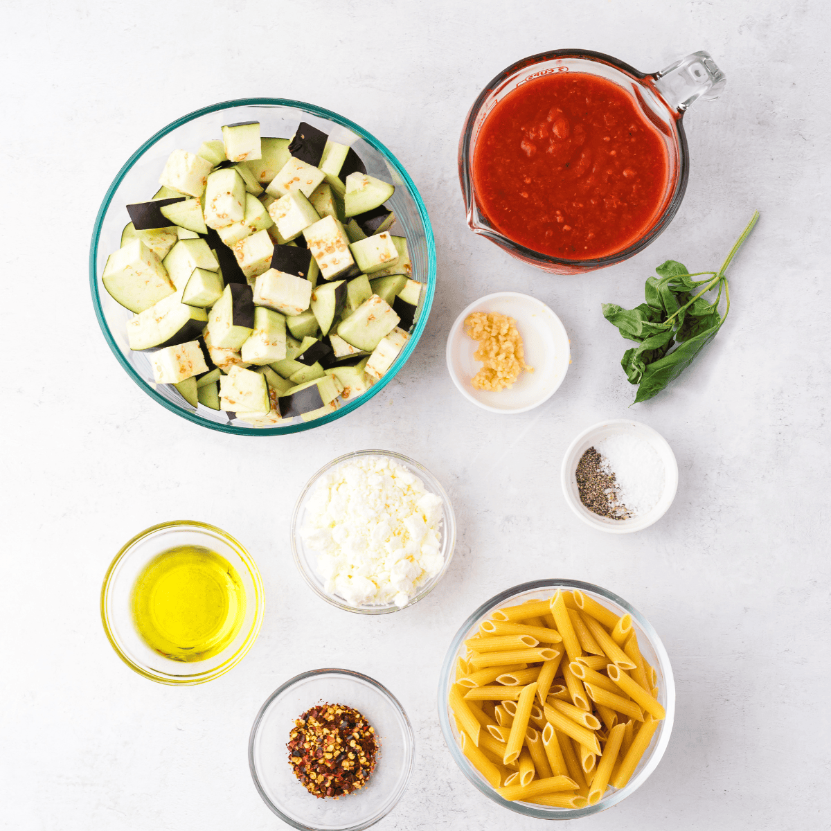 Ingredients needed for Easy Olive Garden Marinara Sauce on kitchen table.