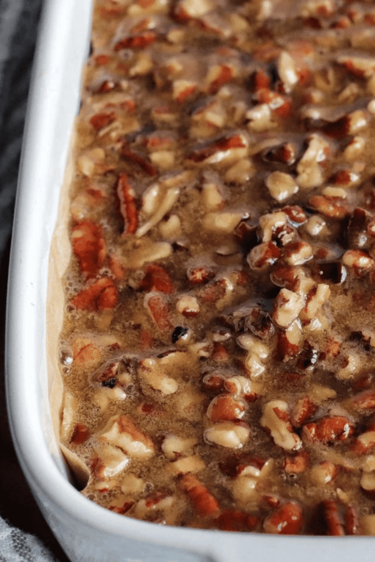 Pouring the maple pecan mixture over the golden, firmed-up crust and air frying for 18-20 minutes until bubbles form on top and the bars firm up.