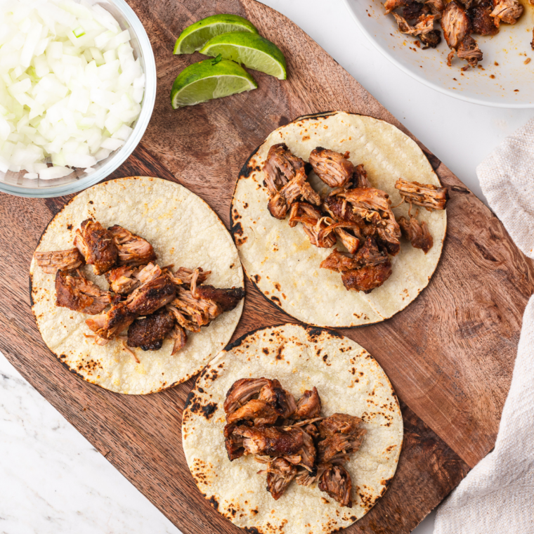 Warm corn tortilla filled with shredded air fryer pork carnitas