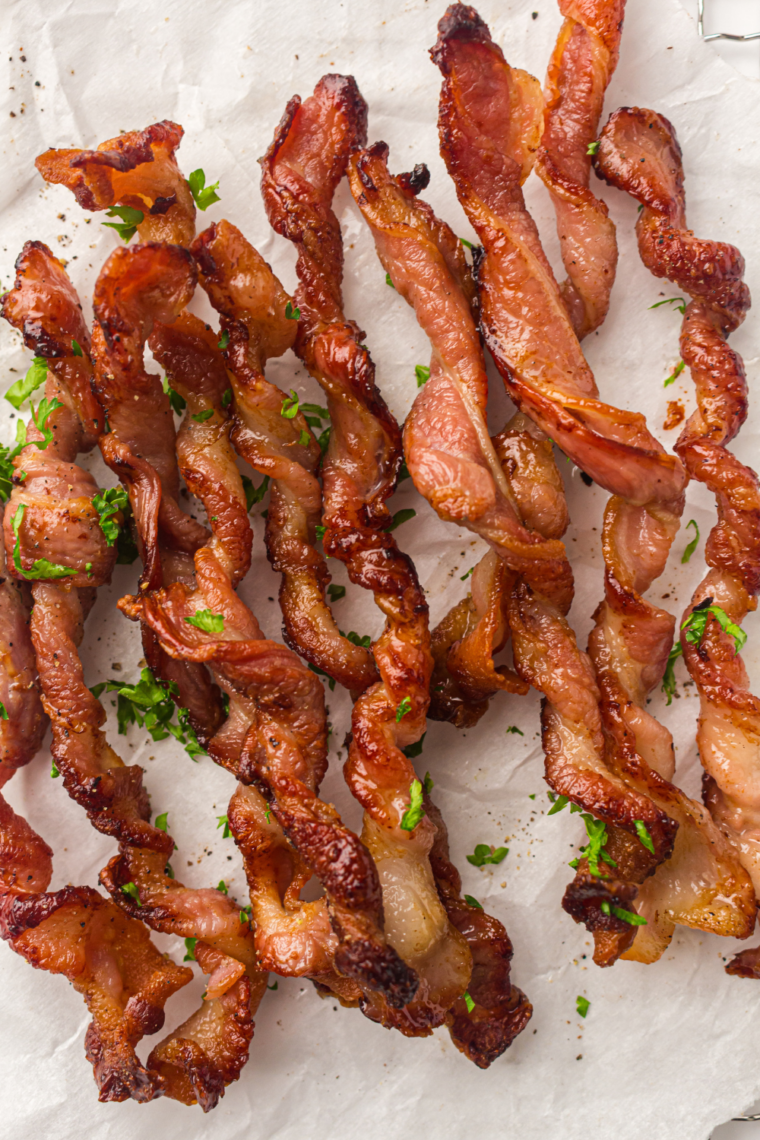 Air fryer bacon twisted into spirals and cooked until crispy and browned creating extra crunch and caramelization for a fun viral breakfast twist