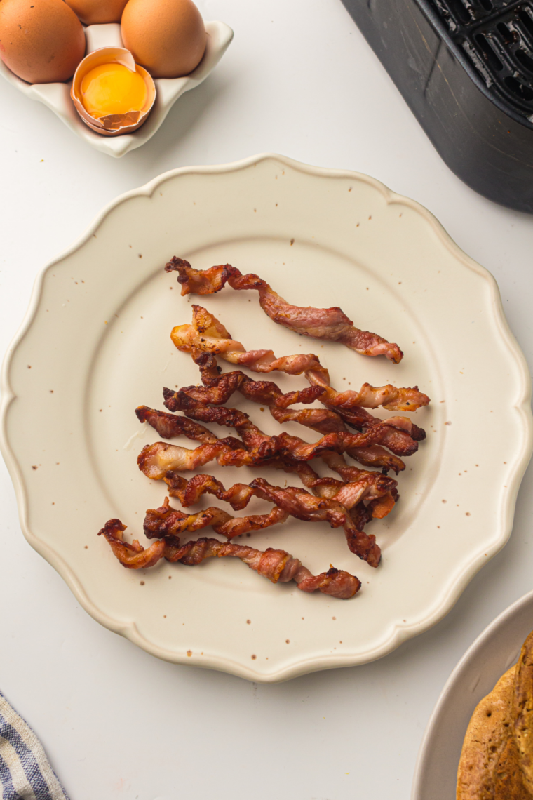 Air fryer twisted bacon strips spiraled and cooked until crispy golden brown with caramelized edges for a viral TikTok bacon upgrade