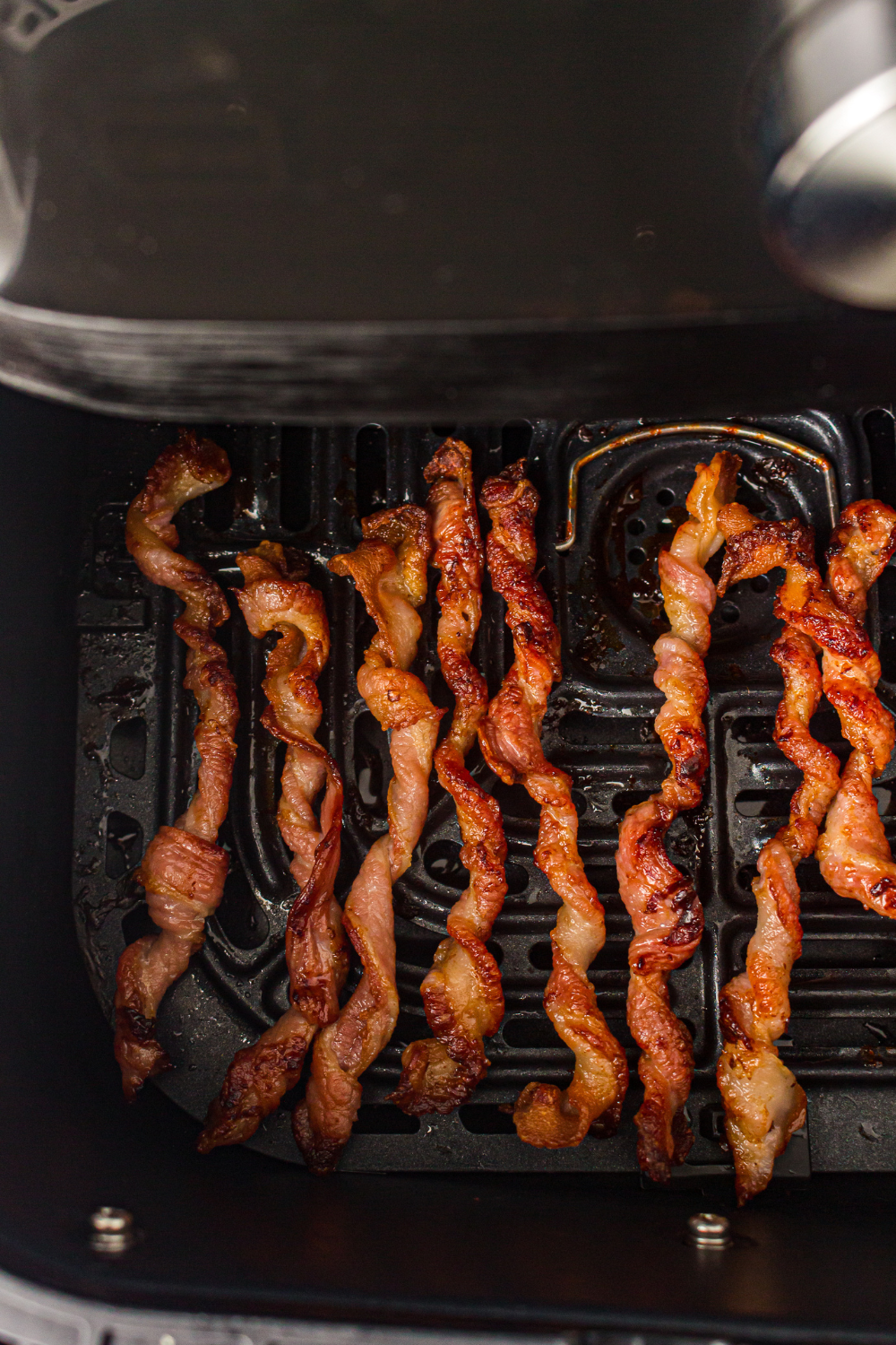 Air fryer bacon twisted into spirals and cooked until deeply golden and crispy for a fun viral TikTok breakfast bacon hack