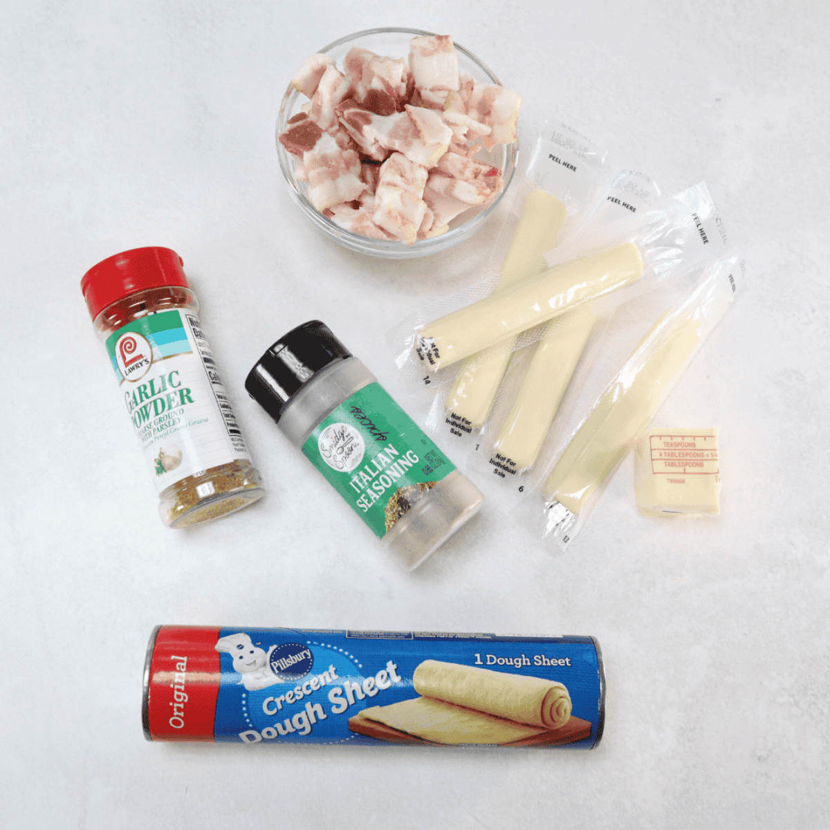 Ingredients needed for Easy Air Fryer Bacon Cheese Bombs on kitchen table.