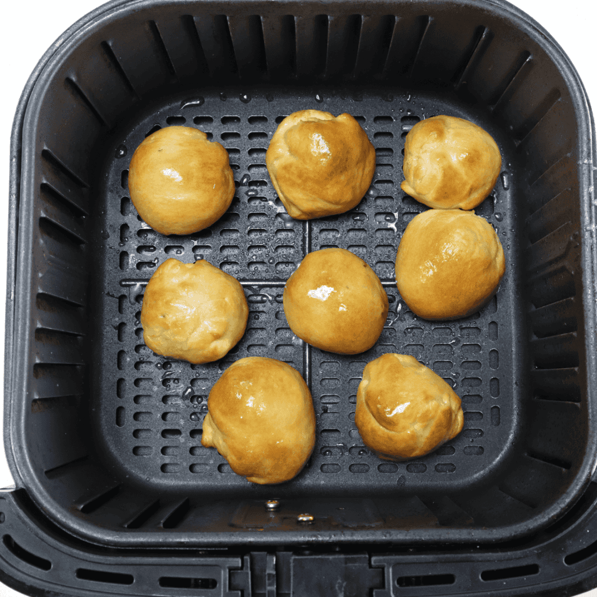 Melted butter mixed with Italian seasoning and garlic powder, brushed over cooled air fryer bacon cheese bombs, served with pizza sauce and ranch