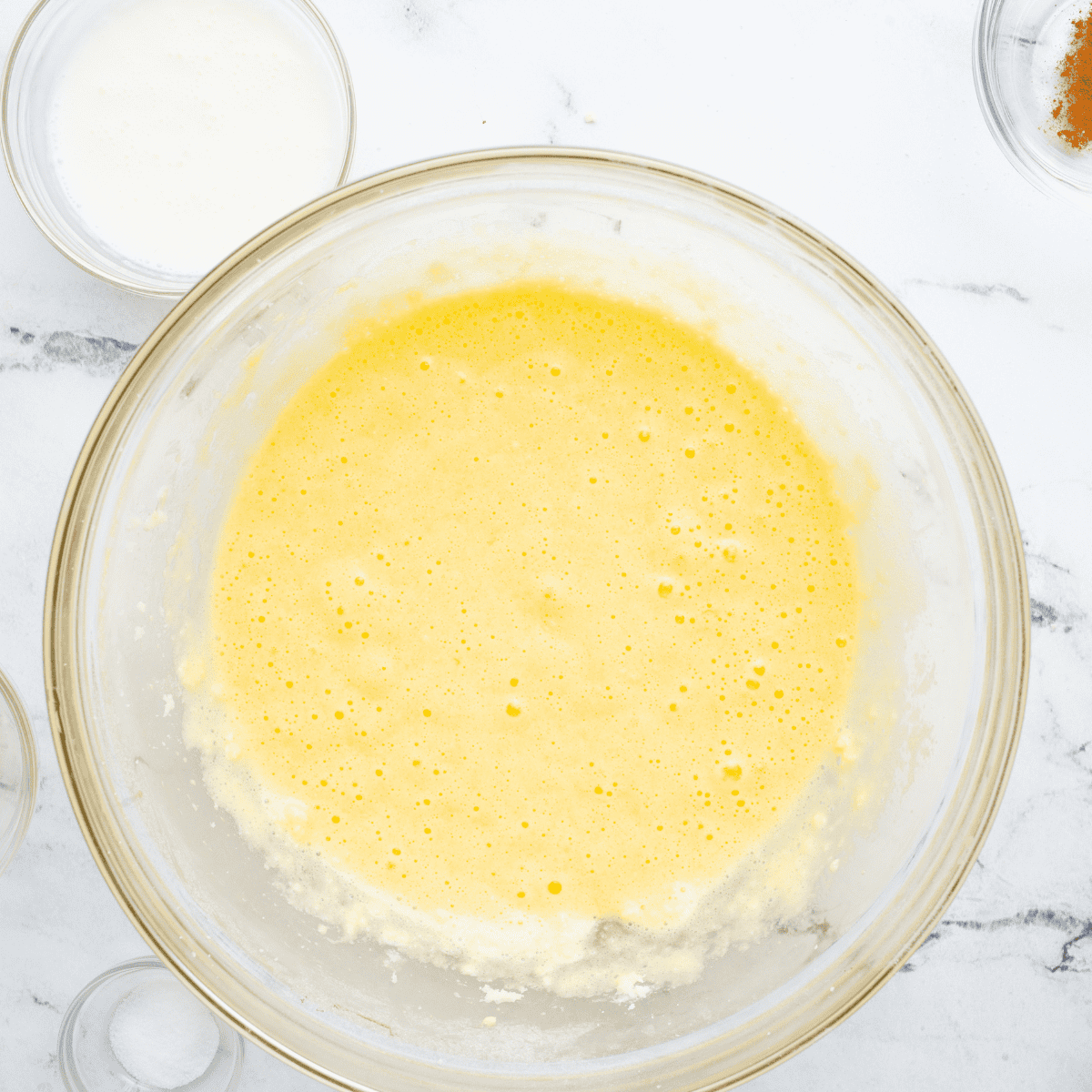 Mixing flour, powdered sugar, cornstarch, salt, and butter to create a coarse crumb crust for air fryer lemon bars.