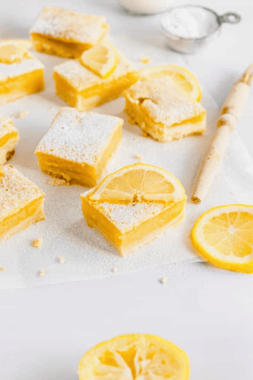 Air fryer lemon bars with golden crust and tangy lemon filling, dusted with powdered sugar, ready to serve.