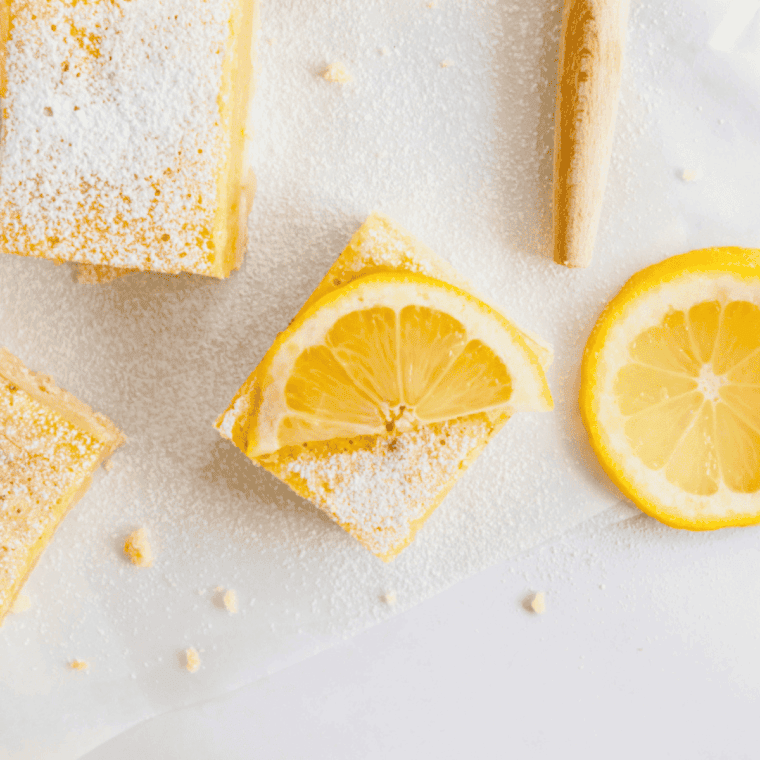 Air fryer lemon bars with golden shortbread crust and tangy, smooth lemon filling, dusted with powdered sugar.