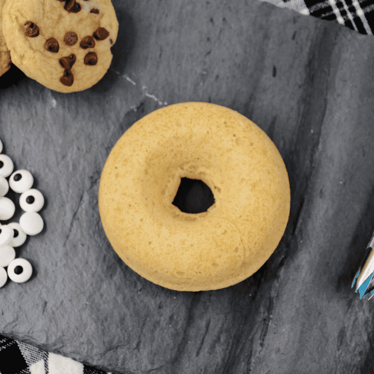 Cooling air fryer donuts on a wire rack after removing from pan