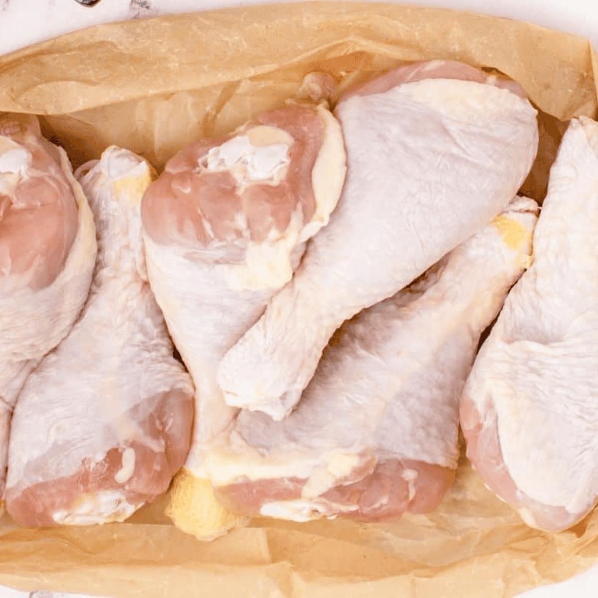 Dry the chicken drumsticks off, for the coating to adhere.