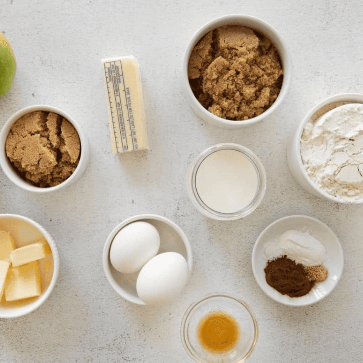 Ingredients needed for Easy Amish Apple Cake Recipe on kitchen table.