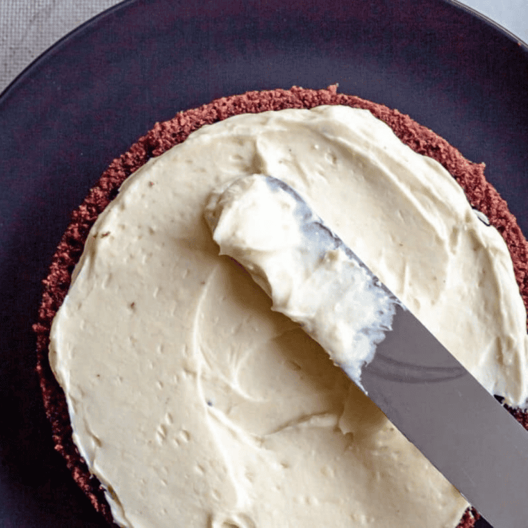 Creamy 3 ingredient cream cheese frosting without butter in a mixing bowl ready for spreading