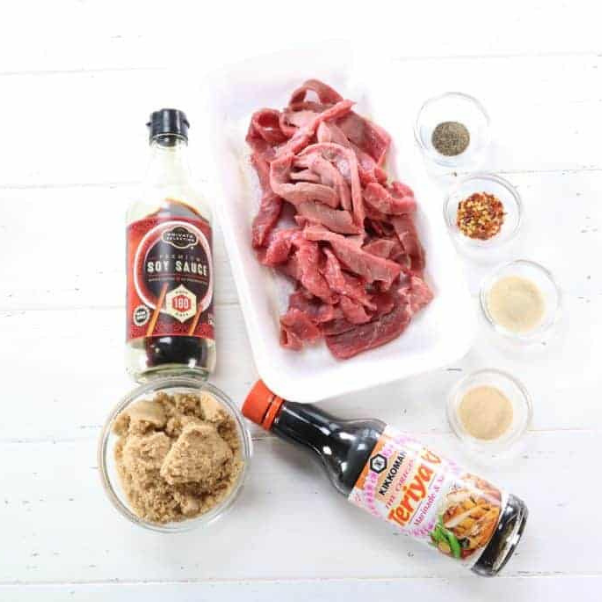 Ingredients needed for Air Fryer Beef Jerky (Easy 3-Hour Homemade Recipe) on wooden white table.