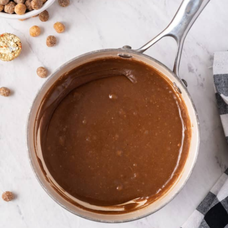 Vanilla glaze stirred smooth with a rubber spatula in a small saucepan over medium-low heat