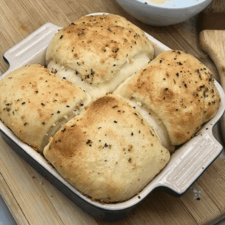 Air fryer cheese stuffed garlic rolls with melted cheese and garlic butter.