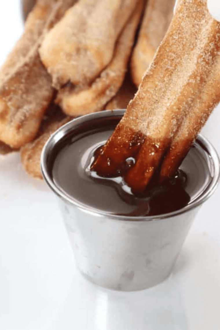 Finished chocolate sauce drizzled over a scoop of ice cream