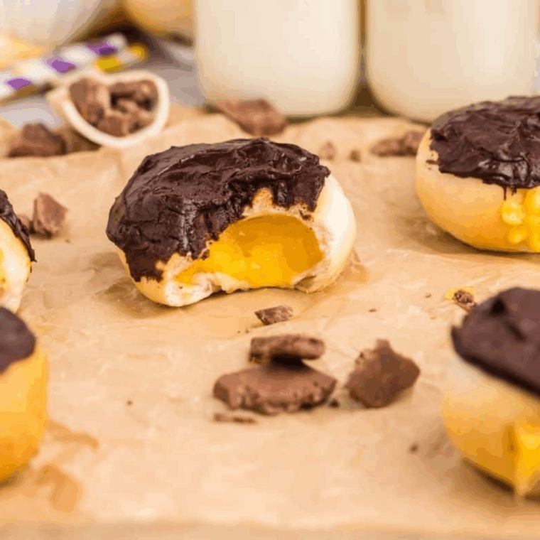 Air fryer Bavarian cream donuts filled with vanilla custard and topped with melted chocolate