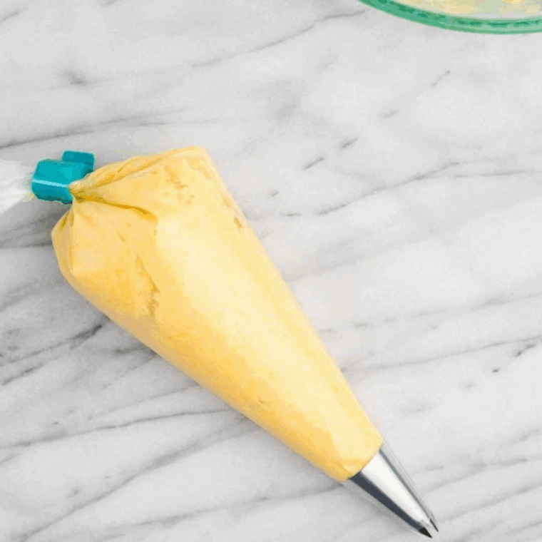 Bavarian cream filling placed into piping bag for donut filling