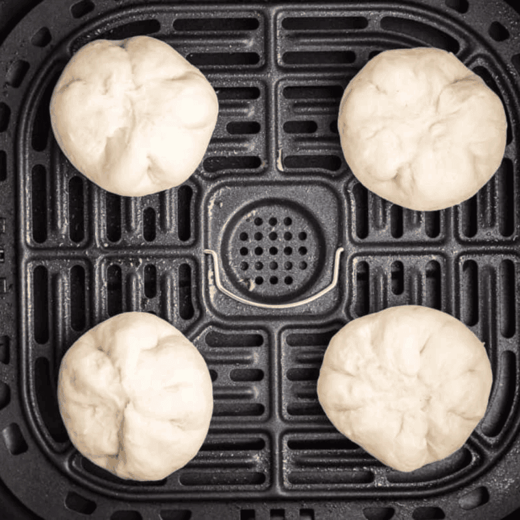 Air frying Bavarian cream donuts in basket until golden and fluffy