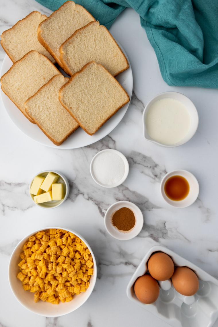 Ingredients needed for Air Fryer Captain Crunch French Toast on kitchen table.