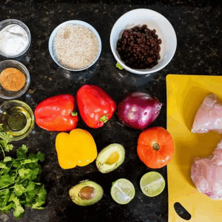 Ingredients needed for Air Fryer Chicken Fajita Rice Bowl on kitchen table.