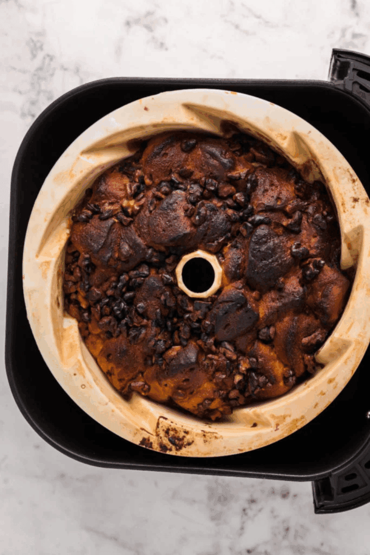 Cooked Cinnamon Roll Monkey Bread in the air fryer basket.