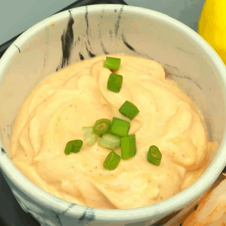 Small bowl of creamy Bang Bang Sauce made with mayonnaise, sweet chili sauce, and sriracha, ready to serve as a dipping sauce.