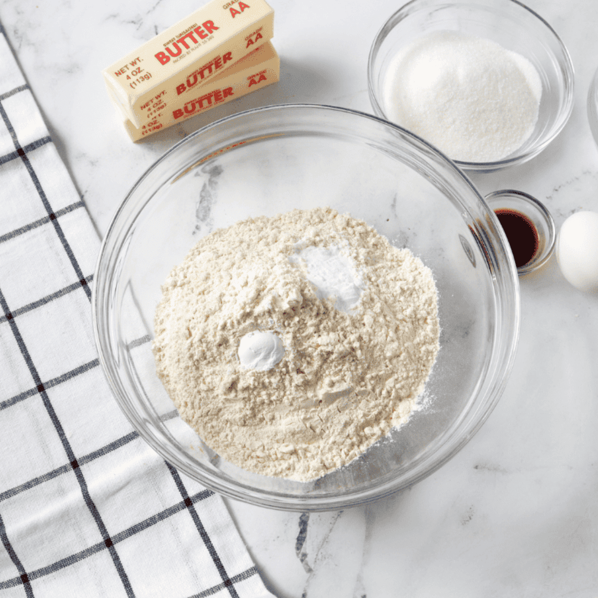 Ingredients needed for Air Fryer Caramel Apple Muffins on kitchen table.