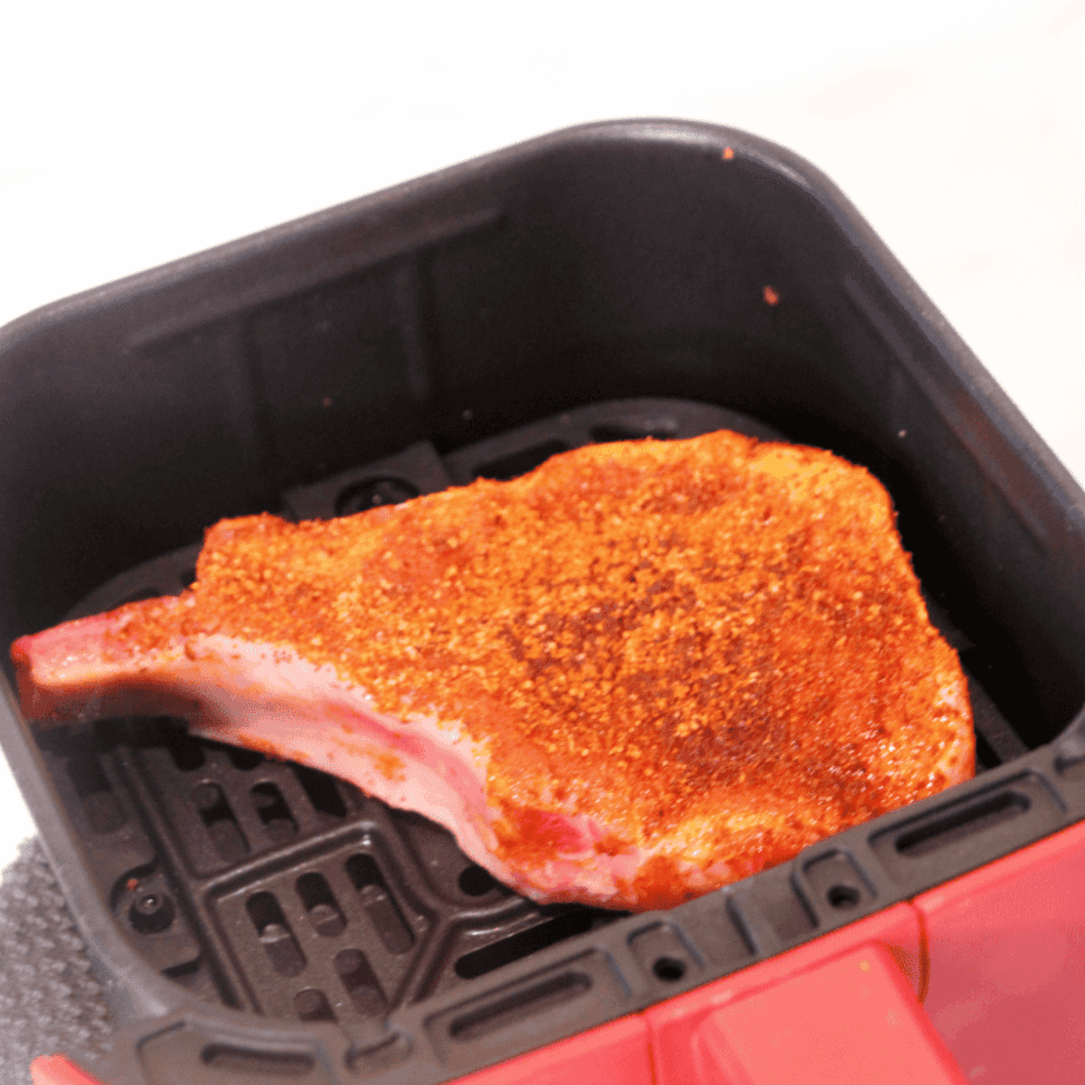 Place Chile Lime Pork Chop in the air fryer basket.