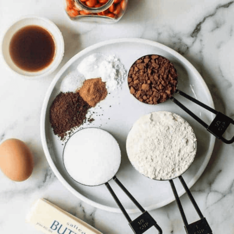 Ingredients needed for Air Fryer Dark Halloween Cookies on kitchen table.